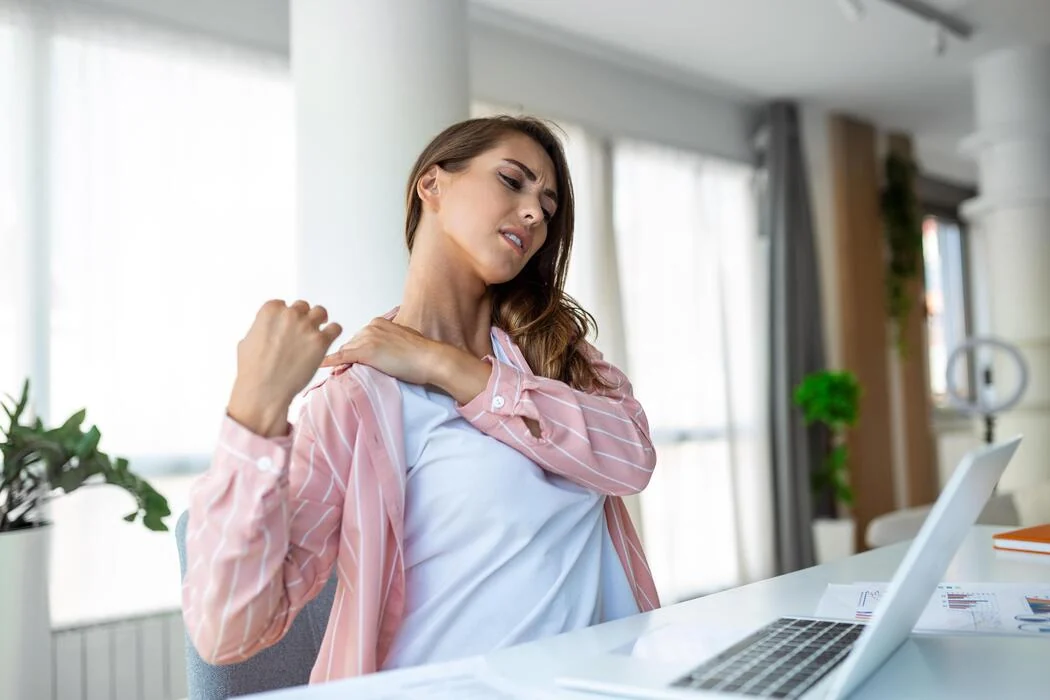 Practitioner assessing a woman’s neck